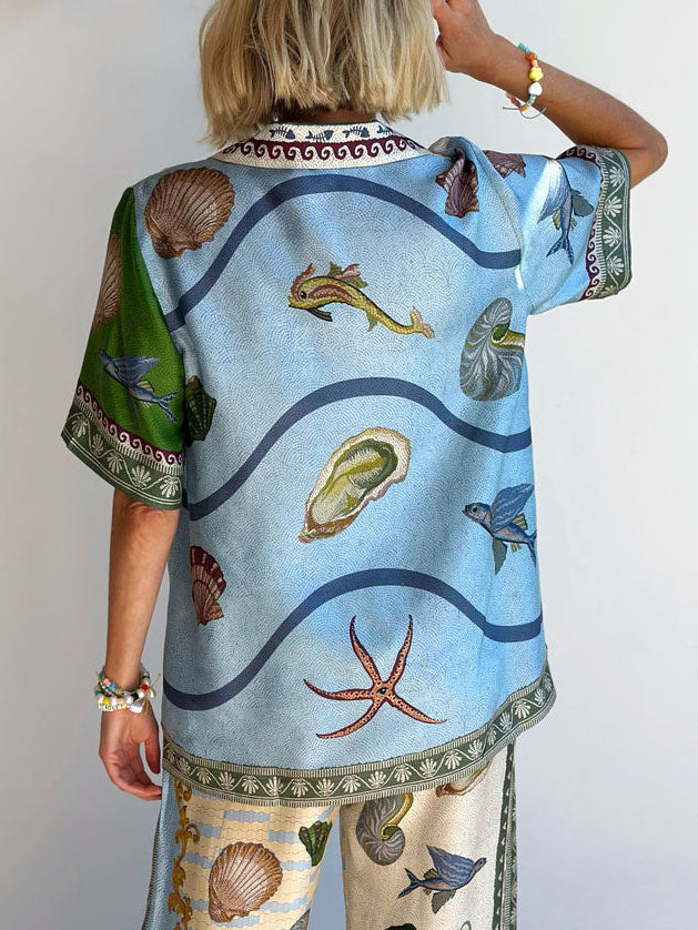 Camisa suelta con estampado floral único de aguas profundas