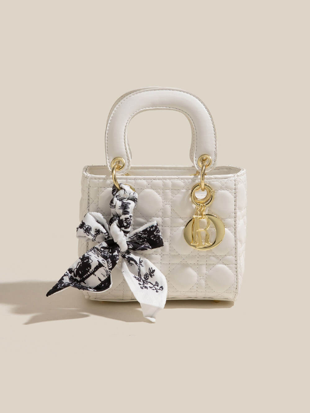 Bolsos cruzados de mano con pañuelo de seda de diamantes